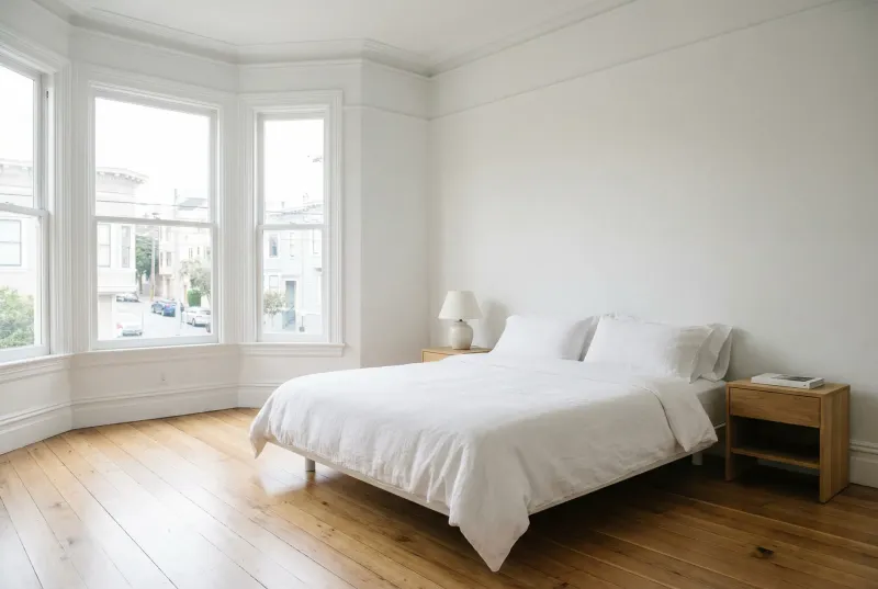 Bright, tidy bedroom after a standard cleaning